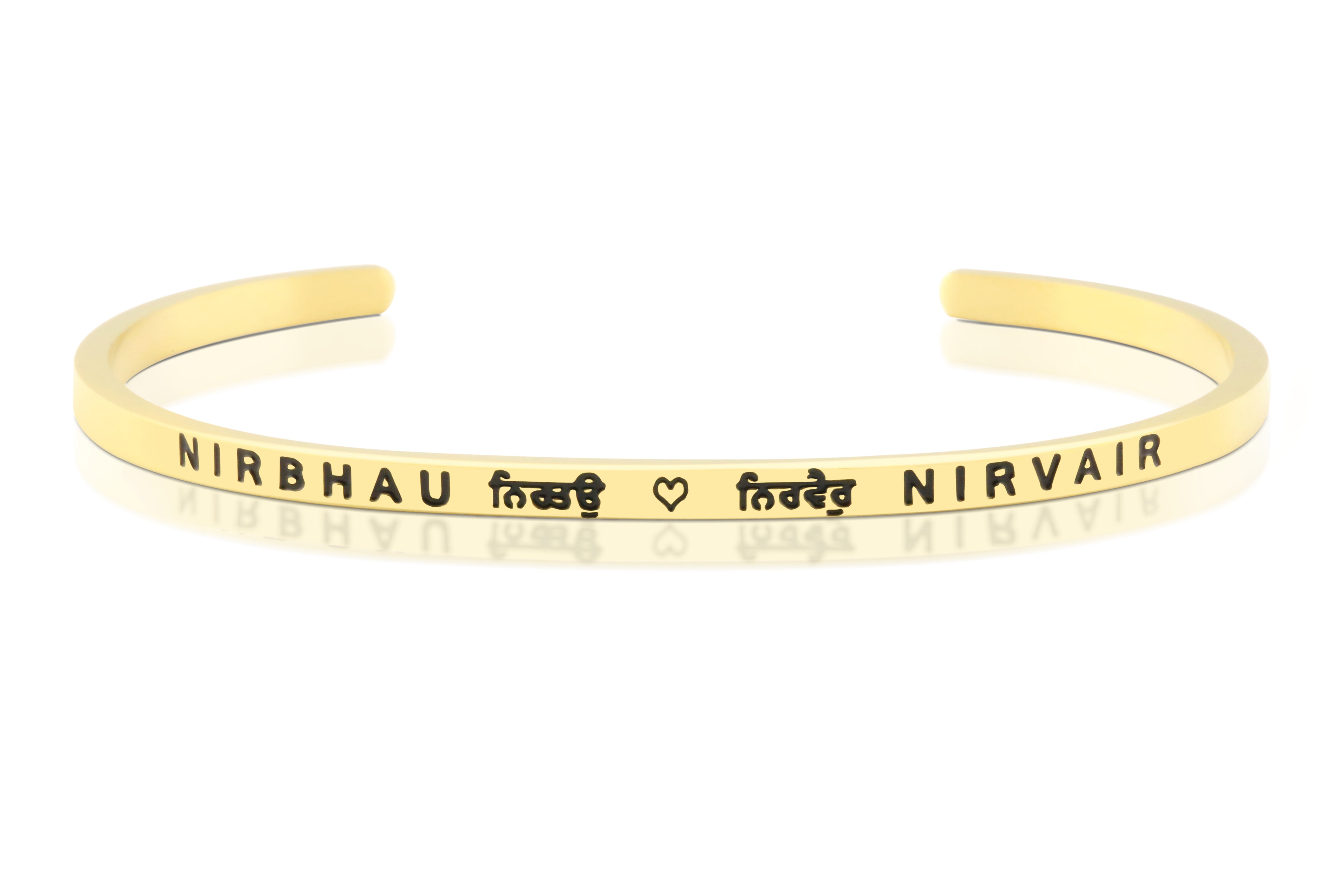 A gold-tone Nirbhau Nirvair band